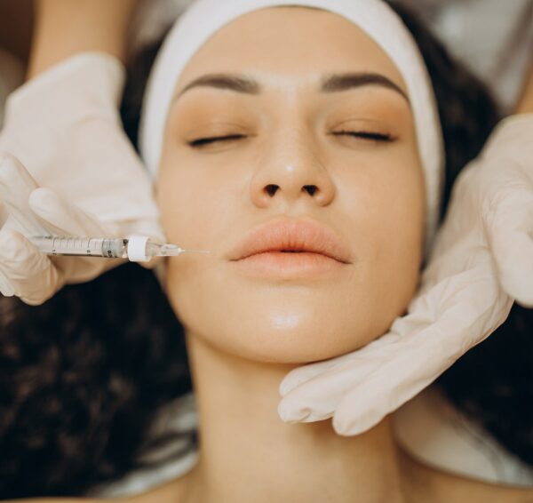 woman-making-injections-cosmetologist